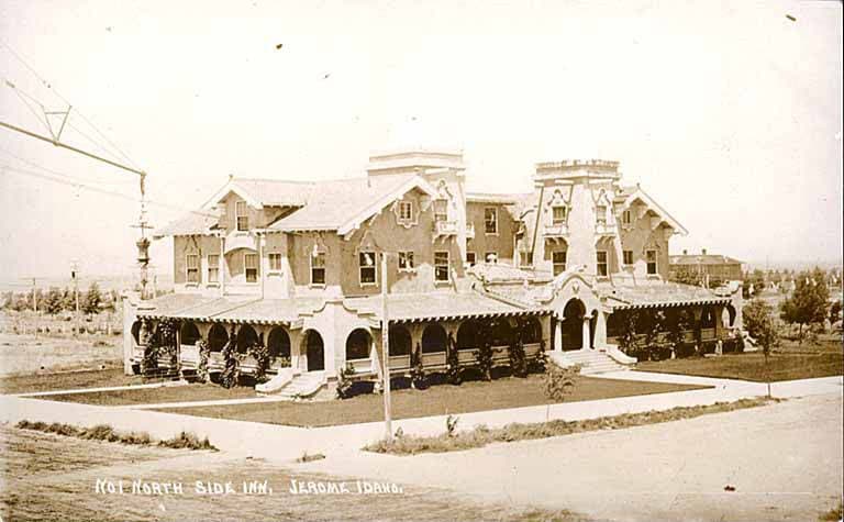 The North Side Inn in Jerome, Idaho, circa 1915: a large stuccoed hotel with arched porches, hand-lettered caption across the foot of the photograph